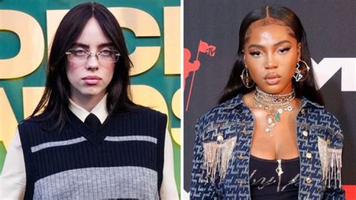 Billie Eilish grabs Quenlin Blackwell's face for a steamy kiss at Coachella