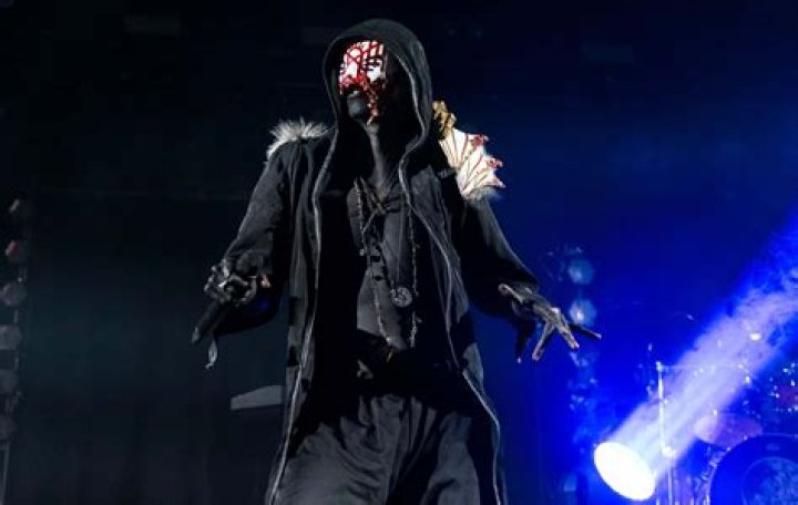 Who is QCXINT? Why does he wear a mask?